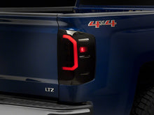 Load image into Gallery viewer, Raxiom 14-18 Chevrolet Silverado 1500 Axial Series LED Tail Lights- Black Housing (Smoked Lens)
