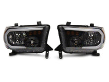 Load image into Gallery viewer, Raxiom 07-13 Toyota Tundra Axial Series Headlights w/ LED Bar- Black Housing (Clear Lens)